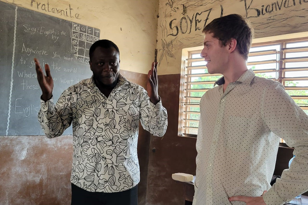 GW alumnus Liam Paup (r) is a Peace Corps volunteer in Benin, Africa.