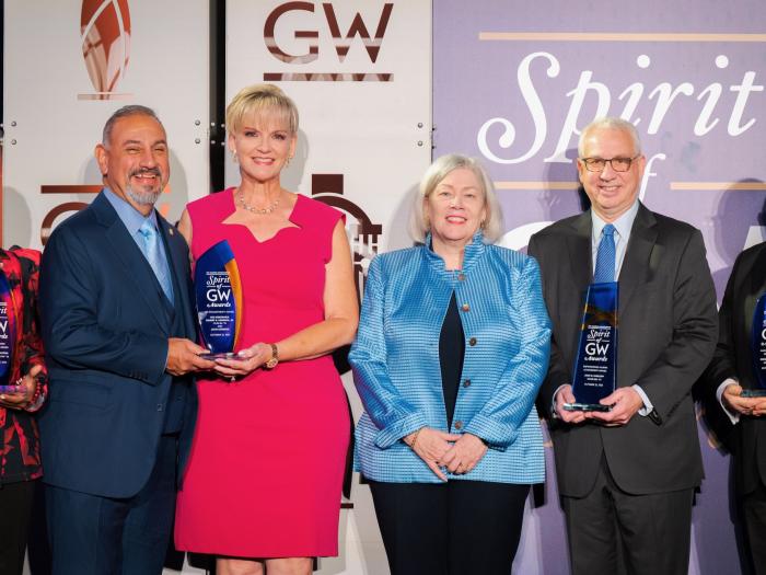 The 2025 Spirit of GW Award recipients with GW President Ellen M. Granberg. From left: Cheryl A. Thaxton, Gilbert R. Cisneros Jr., Jacki Cisneros, Ellen Granberg, Josh N. Kuriloff and Gregory S. Stevens. (Photo: Abby Greenawalt)