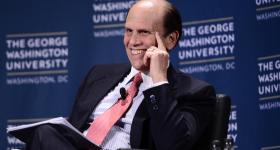 Michael Milken, a top GW benefactor, onstage at a university event in New York City.