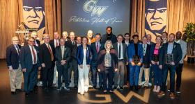 Members of the GW Athletics Hall of Fame Class of 2024 with Athletic Director Tanya Vogel and President Ellen M. Granberg.